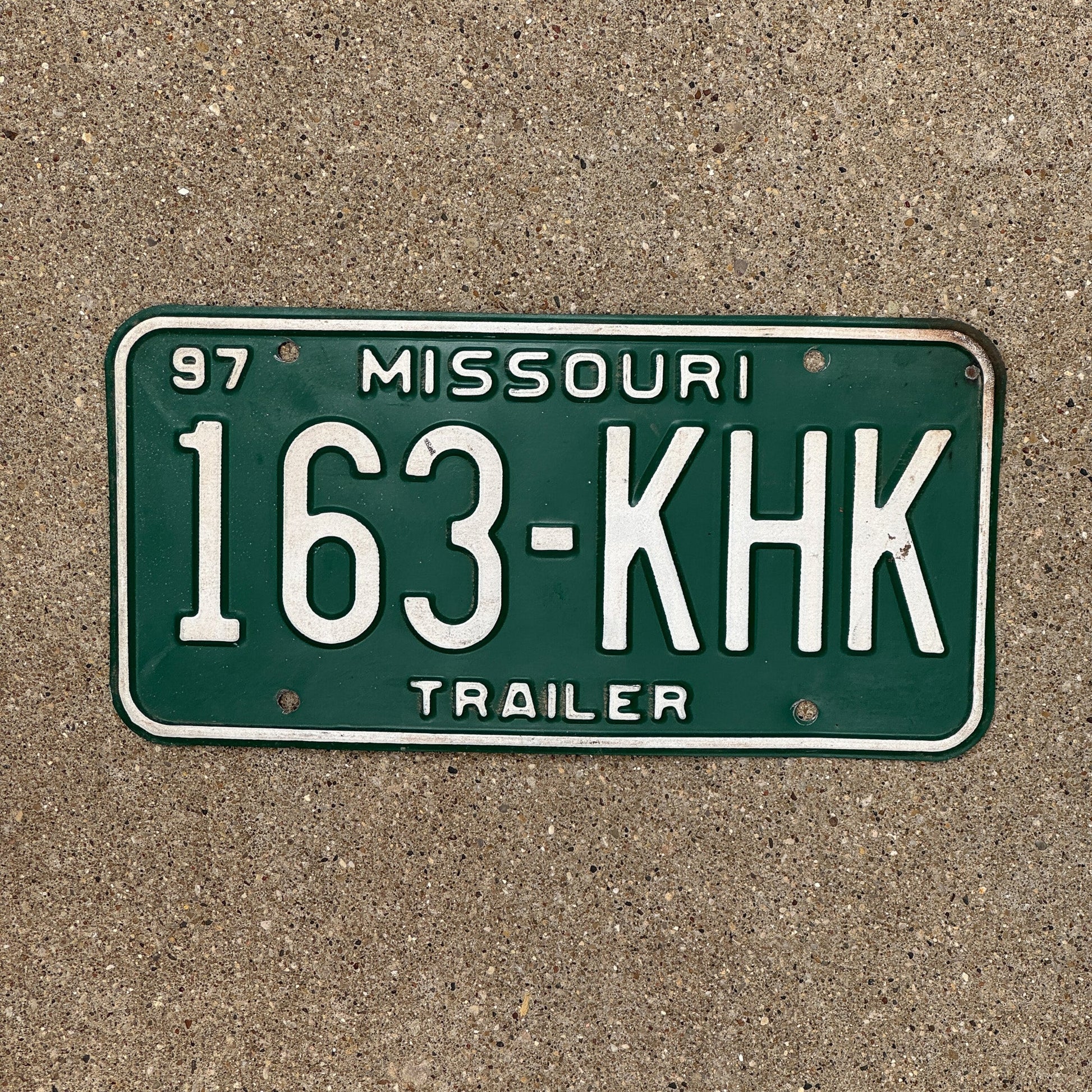 Photo of a 1997 Missouri Trailer License Plate Auto Tag Garage Decor Vintage 163 KHK