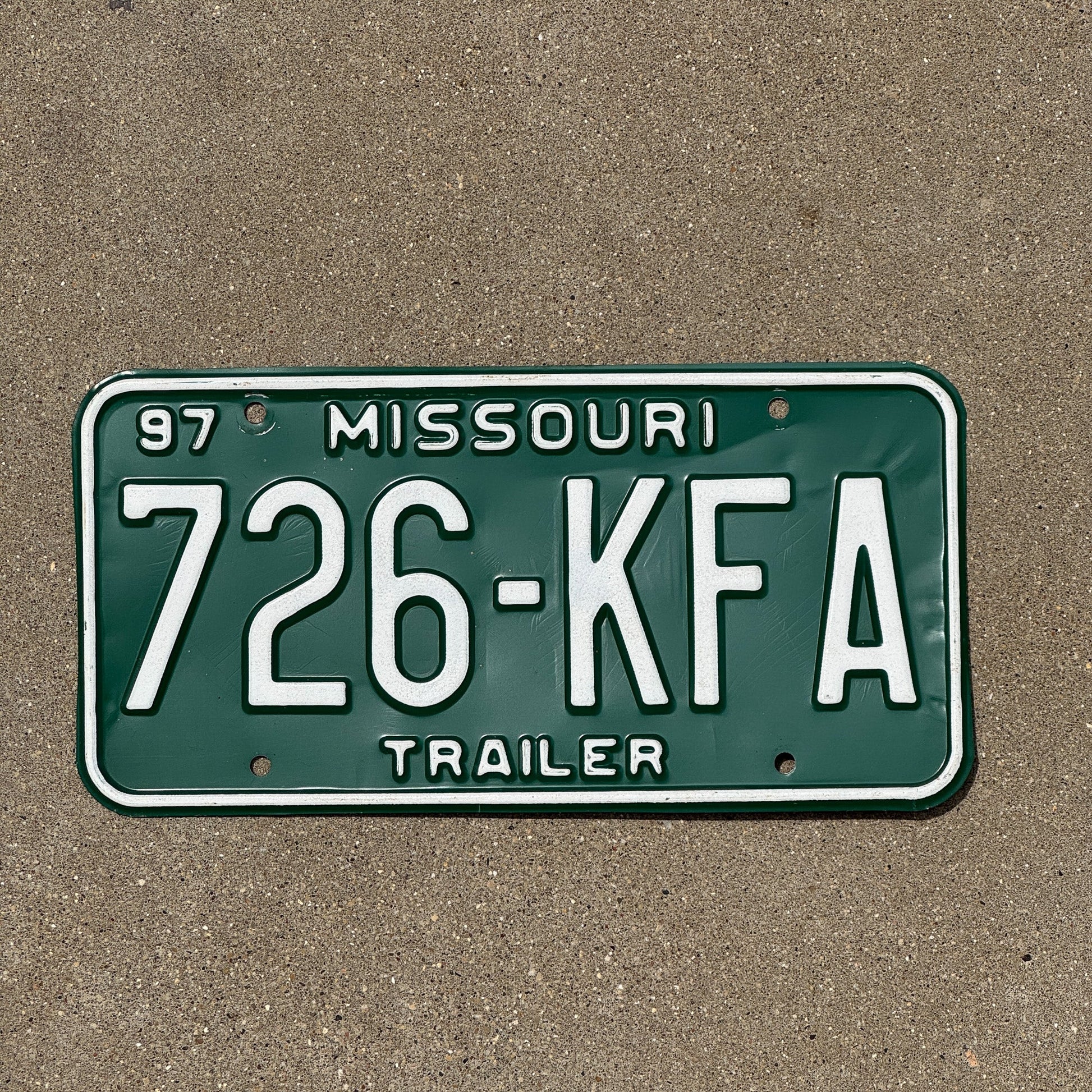 Photo of a 1997 Missouri Trailer License Plate Auto Tag Garage Decor Vintage 726 KFA