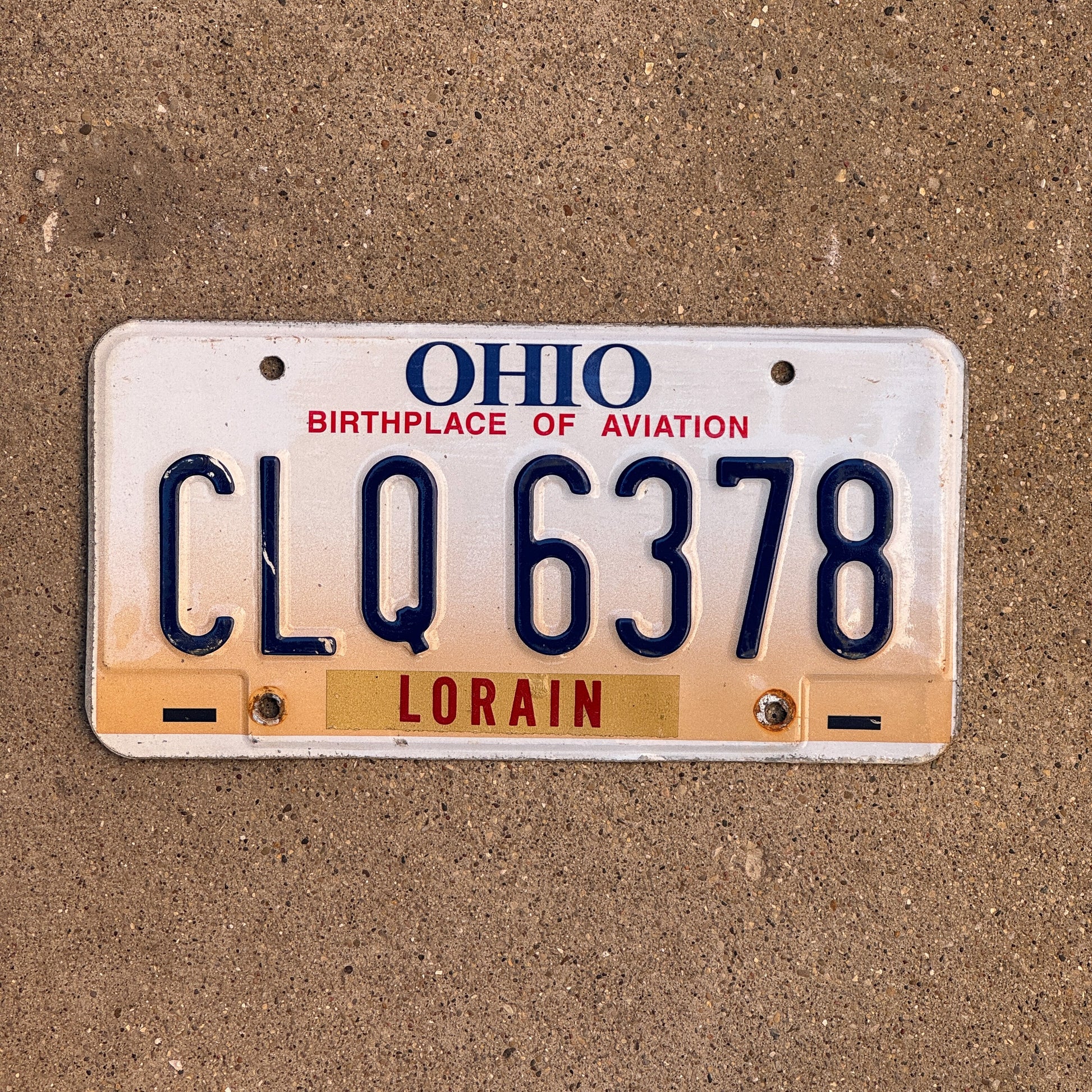 Photo of a 1997 Ohio License Plate Auto Tag 1 Vintage Garage CLQ 6378 with original patina