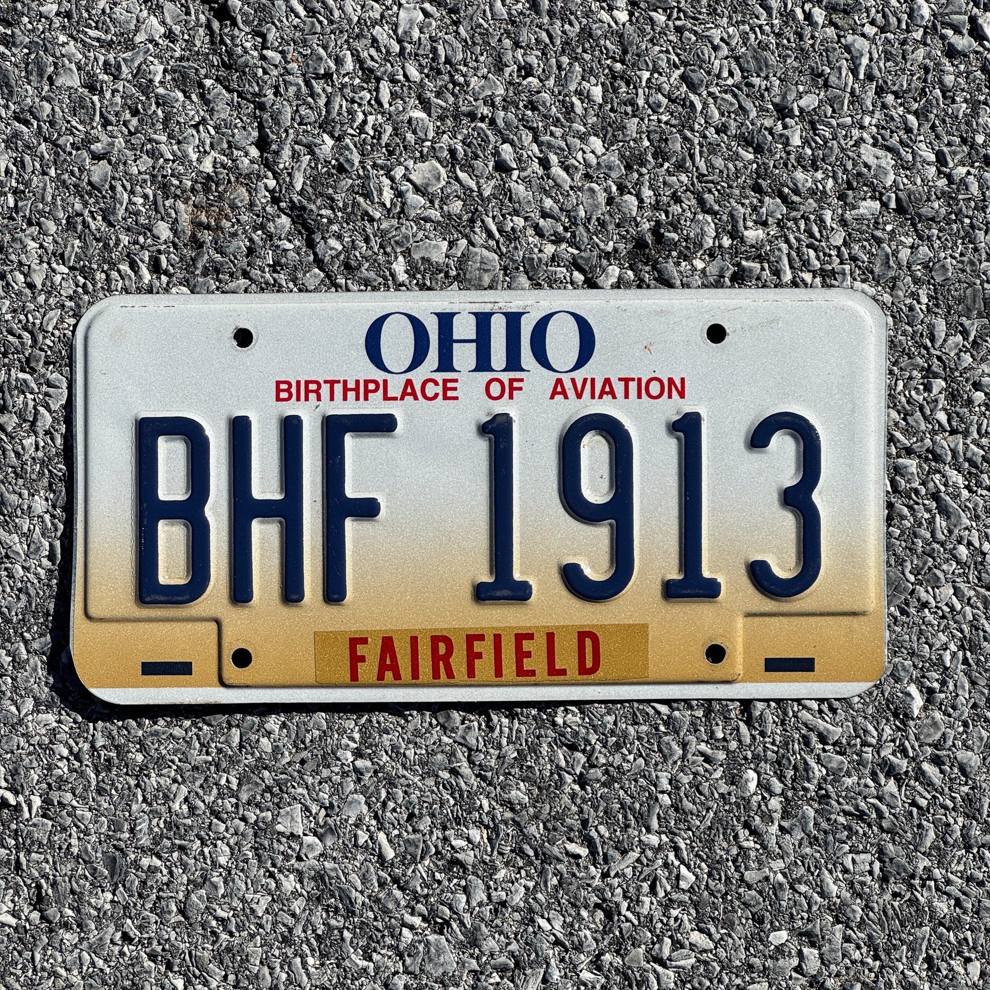 Photo of a 1997 Ohio License Plate Auto Tag 2 Garage Decor BHF 1913