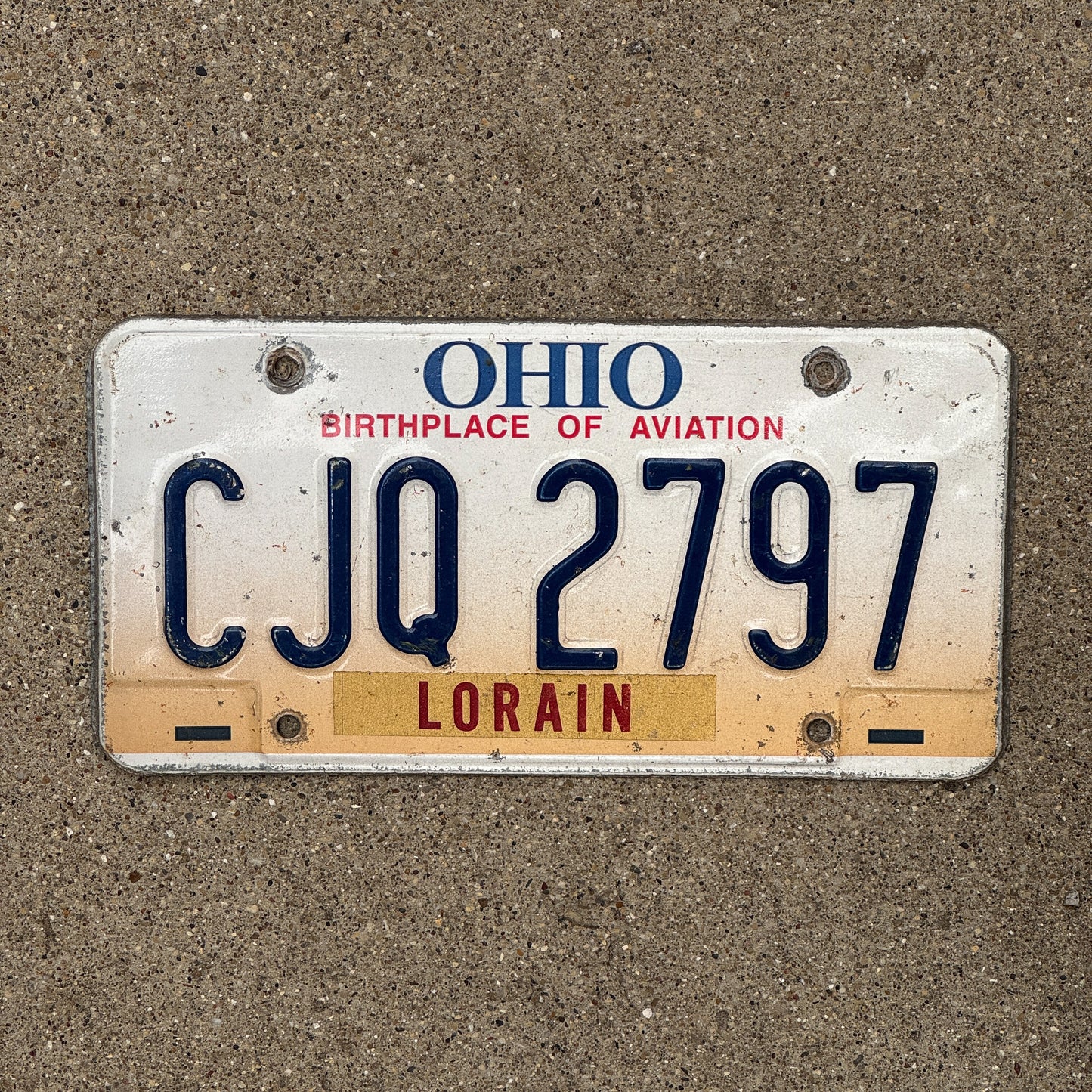 Photo of a 1997 Ohio License Plate Auto Tag 2 Vintage Garage CJQ 2797 with original patina