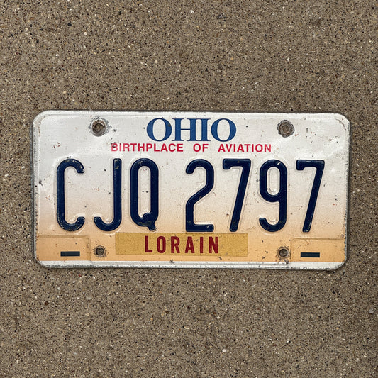 Photo of a 1997 Ohio License Plate Auto Tag 2 Vintage Garage CJQ 2797 with original patina