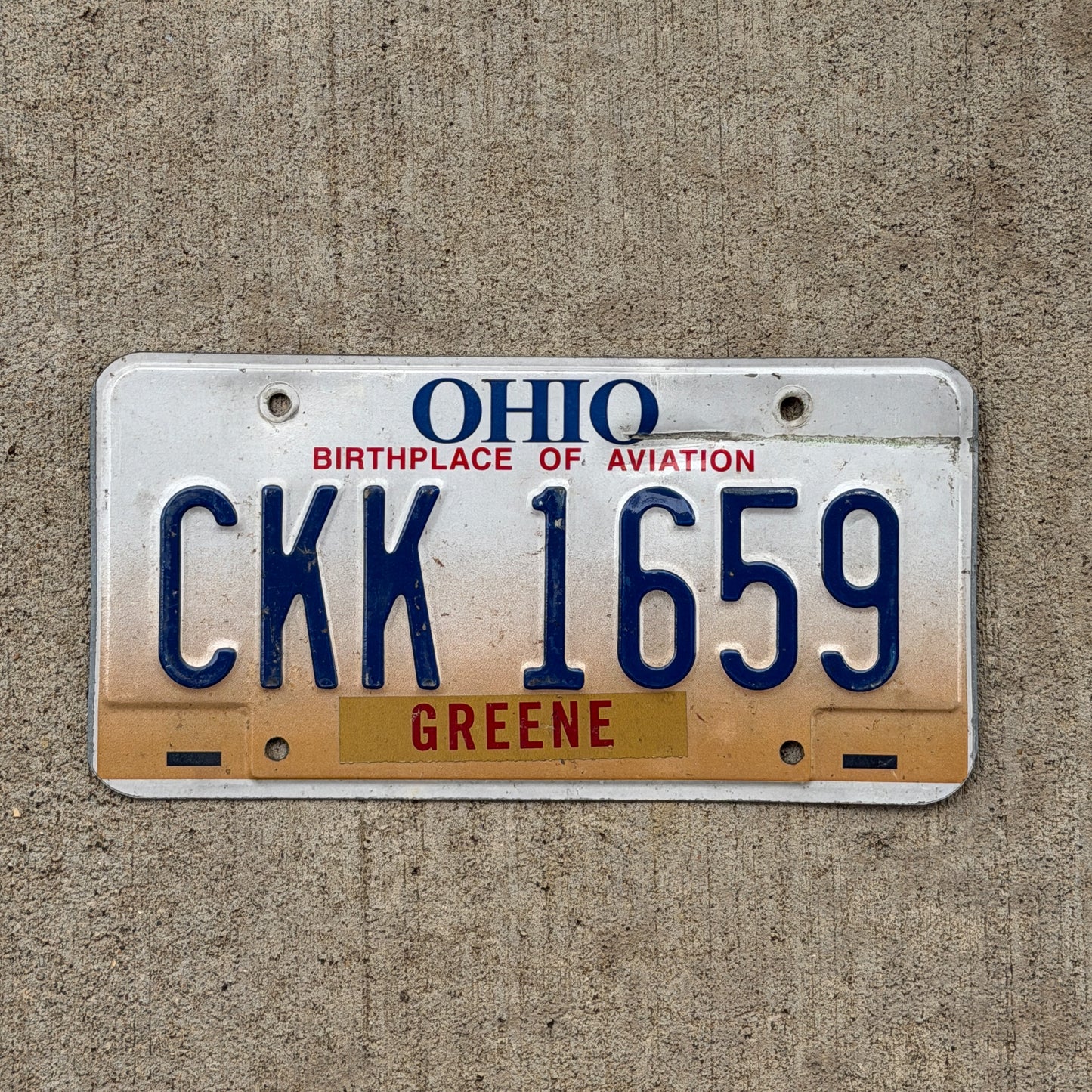 Photo of a 1997 Ohio License Plate Auto Tag Garage Decor Vintage CKK 1659 with original patina