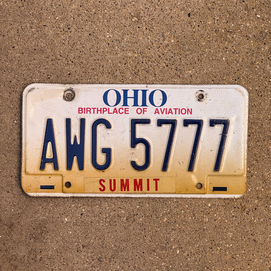 Photo of a 1997 Ohio License Plate Auto Tag Garage Decor Vintage Lucky 7 Repeat Repeating AWG 5777 with original patina