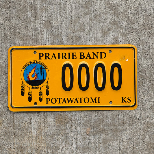 Photo of a 1997 Prairie Band Potawatomi Kansas Graphic Sample License Plate Auto Tag Garage Decor Vintage Native American Indian Tribe 0000 with original patina