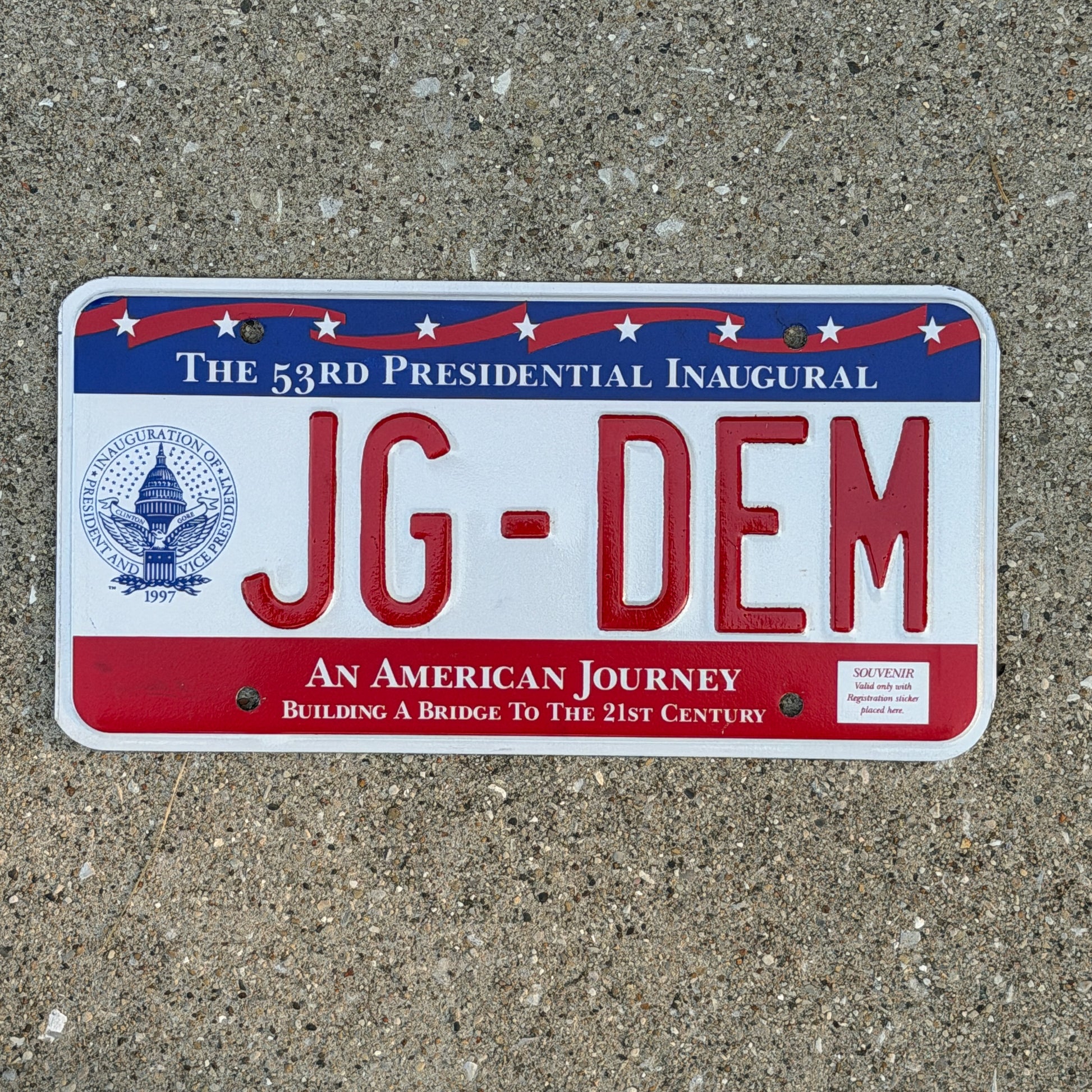 Photo of a 1997 Washington DC Inaugural Vanity License Plate Auto Tag Garage Decor Vintage Clinton Inauguration Politics Political JG DEM with original patina