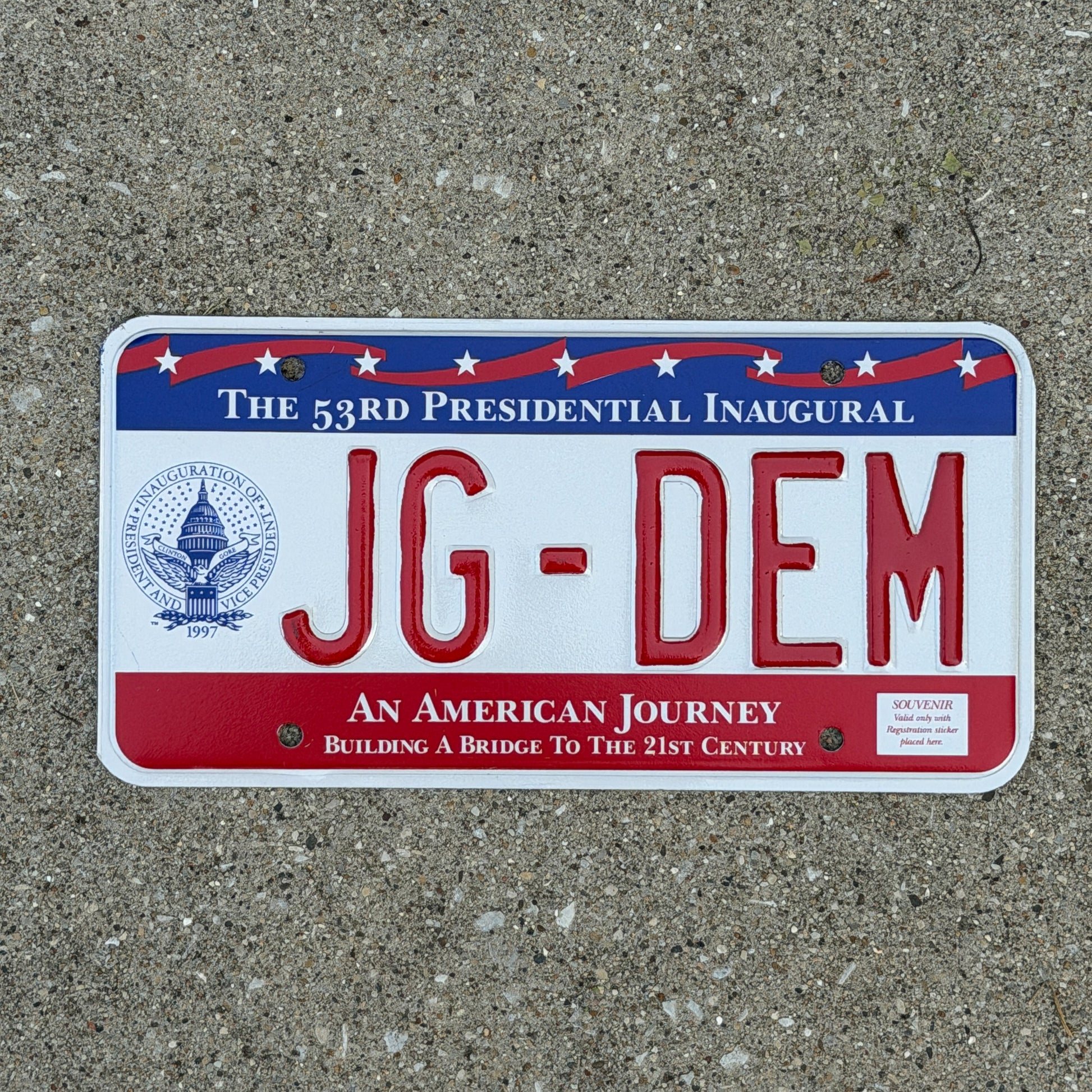 Photo of a 1997 Washington DC Inaugural Vanity License Plate Auto Tag Garage Decor Vintage Clinton Inauguration Politics Political JG DEM with original patina
