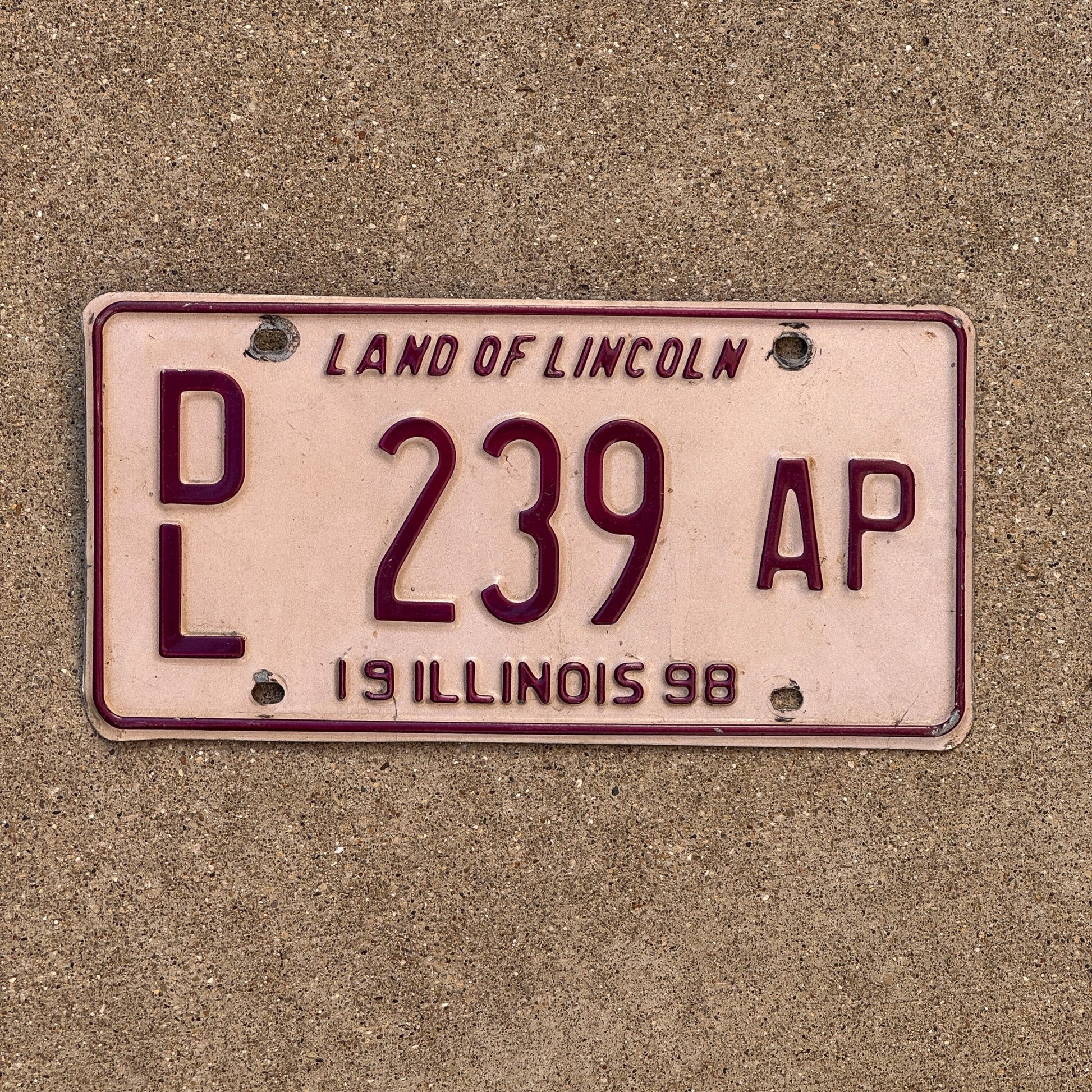 Photo of a 1998 1998 Illinois Dealer License Plate Auto Tag Garage Decor Vintage Pink DL 239 AP