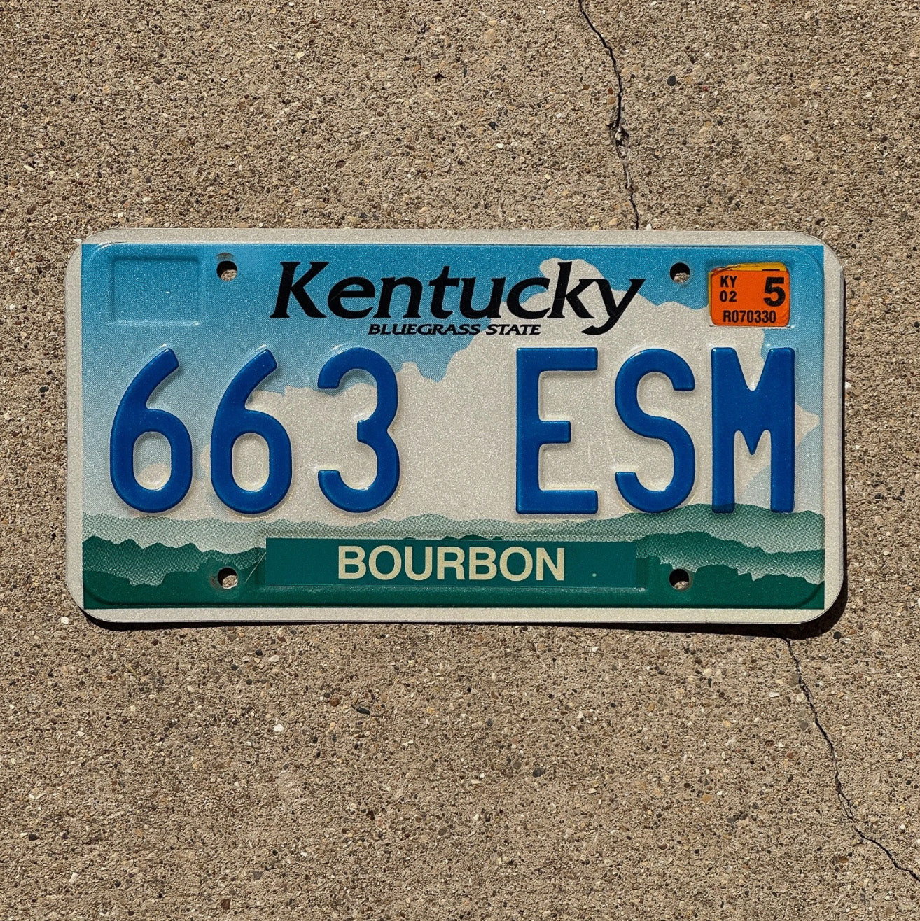 Photo of a 1998 2002 Kentucky License Plate Auto Tag Garage Decor Vintage Bourbon County Bar Decor 663 ESM with original patina