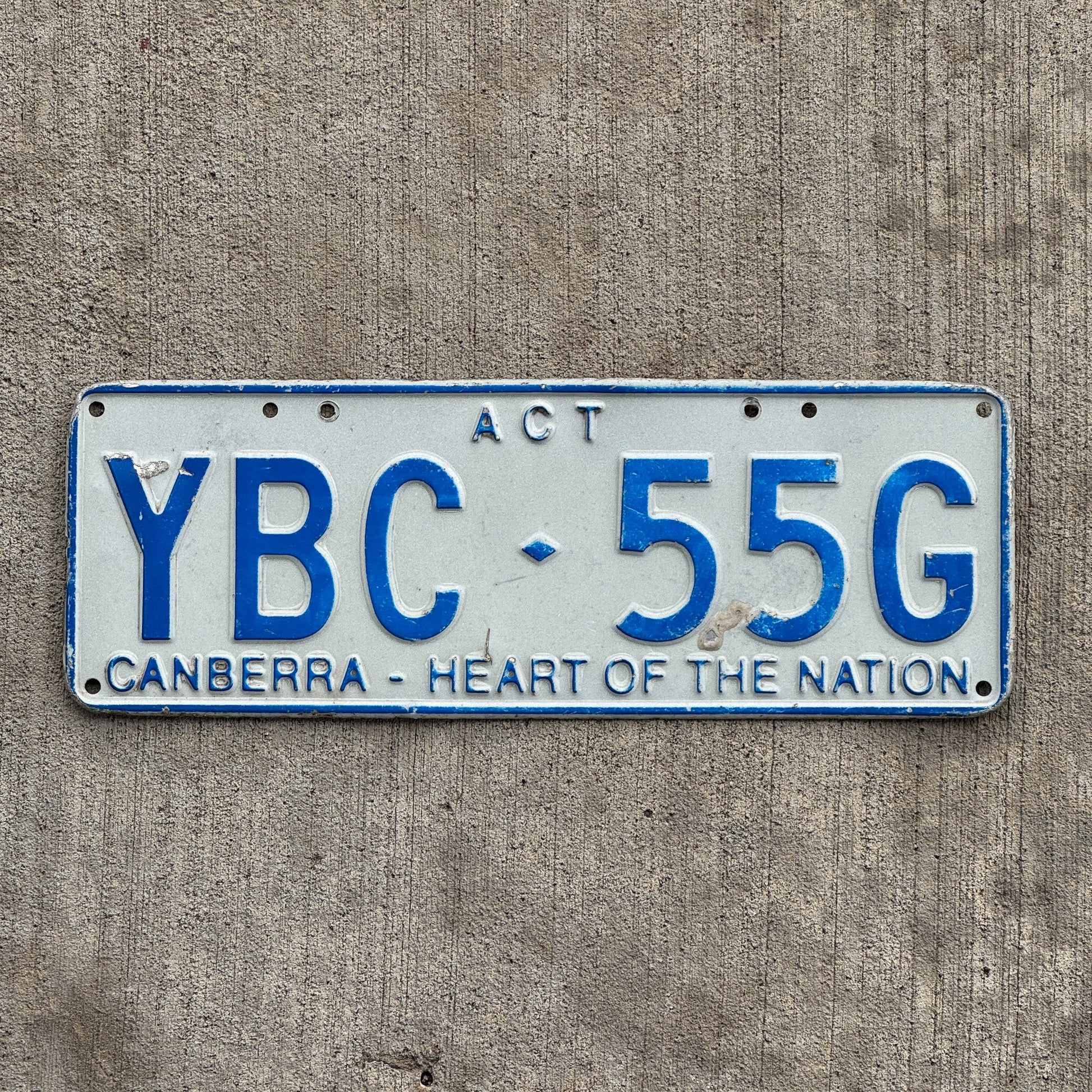 Photo of a 1998 Australian Capital Territory ACT License Plate Auto Tag Garage Decor Vintage Canberra Heart of the Nation YBC 55G with original patina