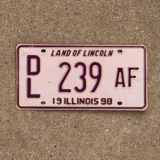 Photo of a 1998 Illinois Dealer License Plate Auto Tag Garage Decor Vintage Pink DL 239 AF