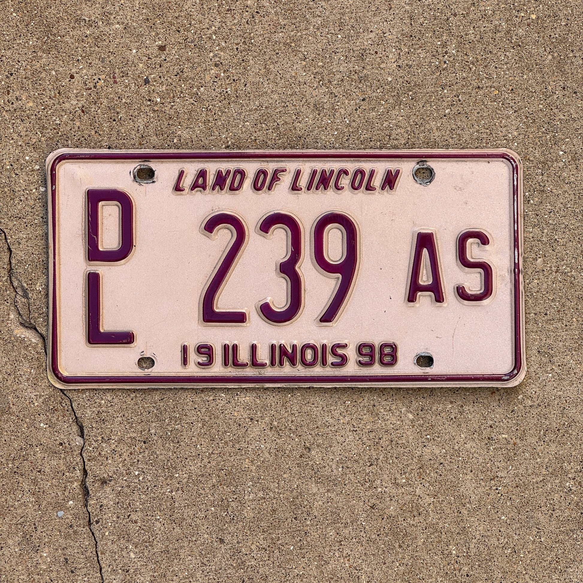 Photo of a 1998 Illinois Dealer License Plate Auto Tag Garage Decor Vintage Pink DL 239 AS