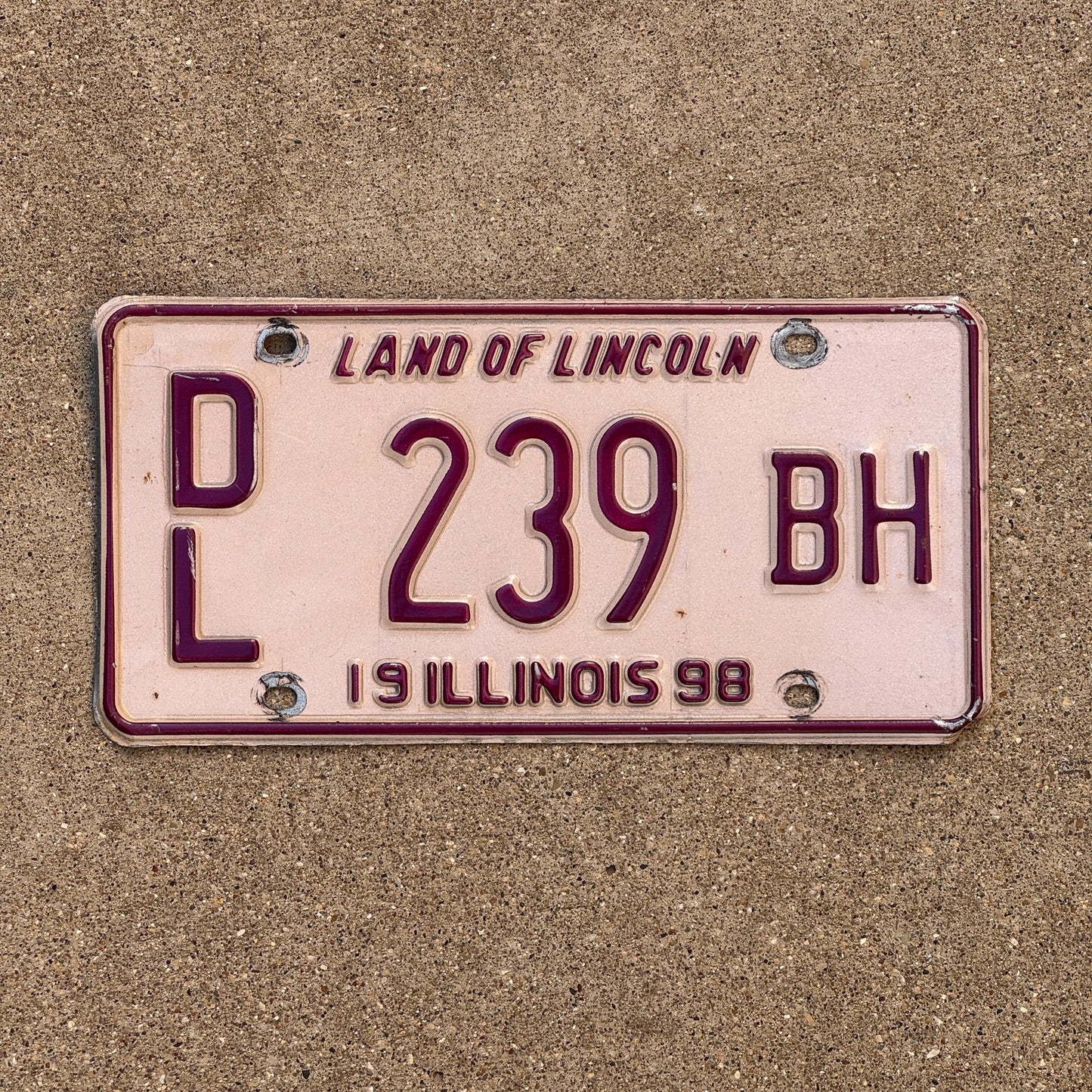 Photo of a 1998 Illinois Dealer License Plate Auto Tag Garage Decor Vintage Pink DL 239 BH