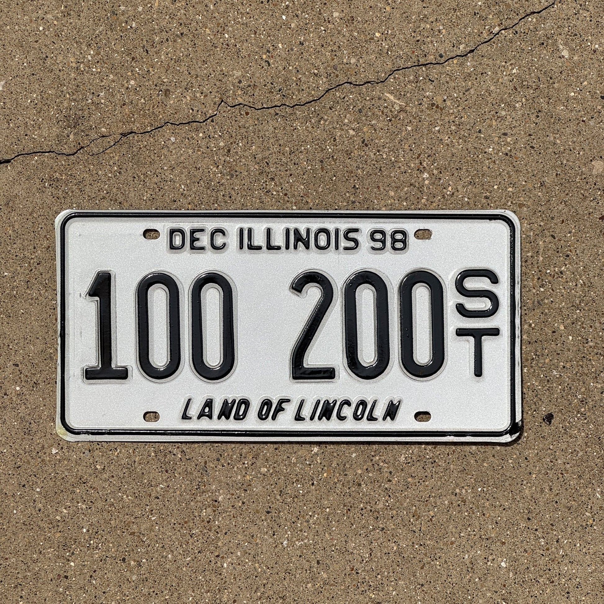 Photo of a 1998 Illinois Semi Trailer License Plate Auto Tag Garage Decor Vintage Fun Number 100 200 ST