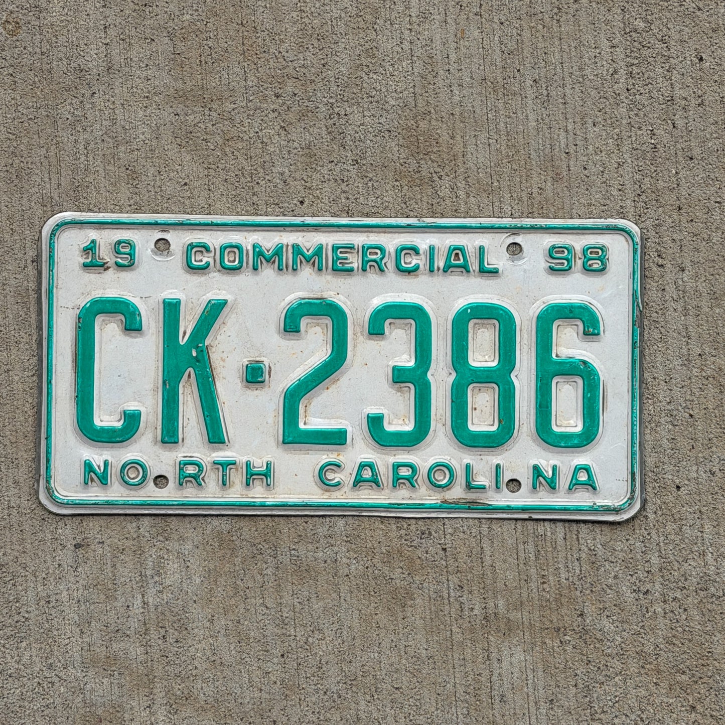 Photo of a 1998 North Carolina Commercial License Plate Auto Tag Garage Decor Vintage CK 2386 with original patina
