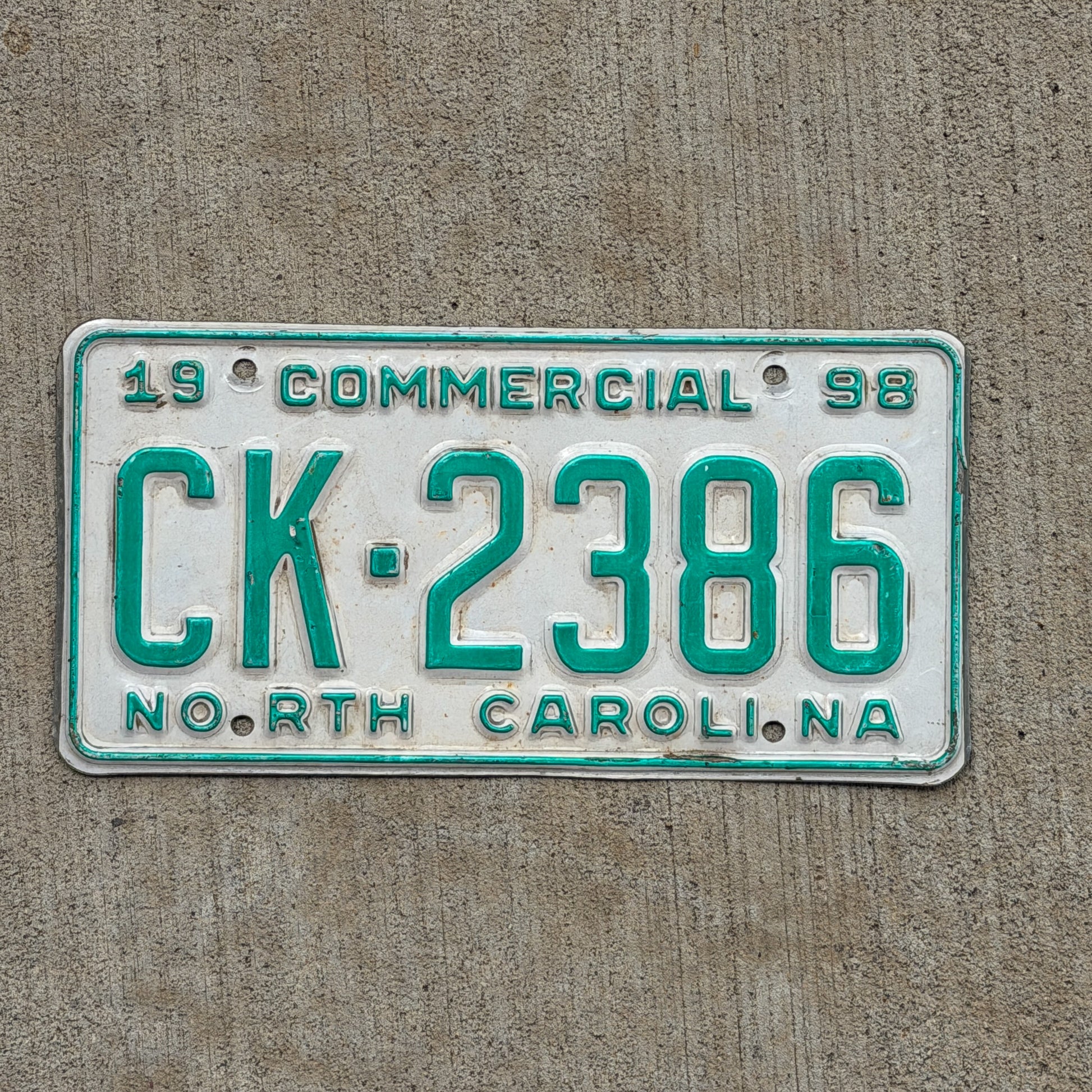 Photo of a 1998 North Carolina Commercial License Plate Auto Tag Garage Decor Vintage CK 2386 with original patina