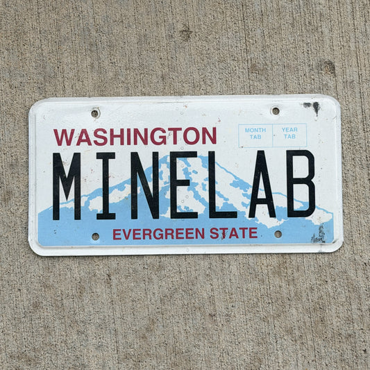 Photo of a 1998 Washington Vanity License Plate Auto Tag Garage Decor Vintage MINE LAB with original patina