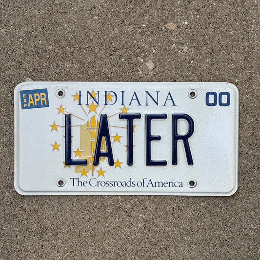 Photo of a 1999 2000 Indiana Vanity License Plate Auto Tag Garage Decor Vintage Bye So Long LATER with original patina