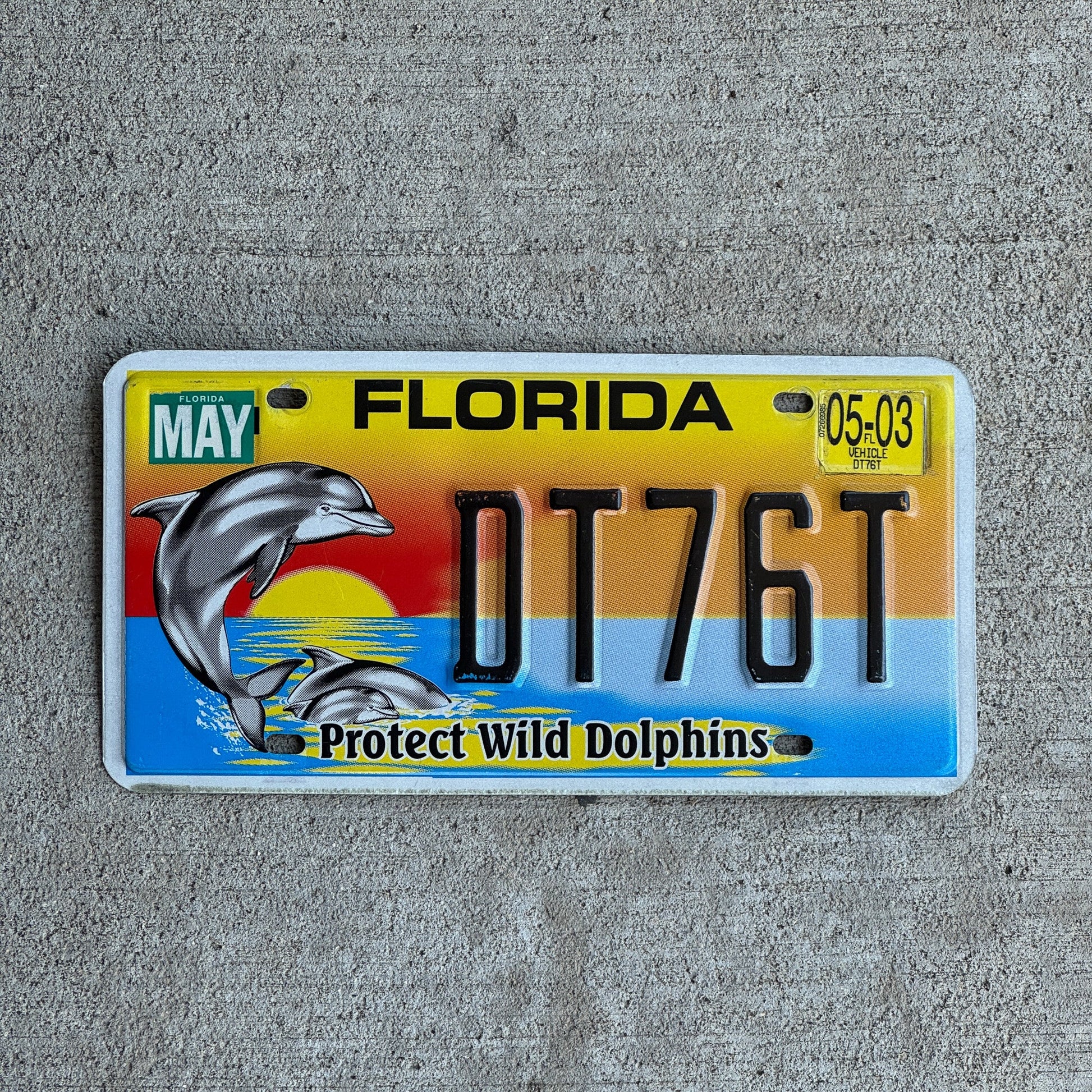 Photo of a 1999 2003 Florida Graphic / Specialty License Plate Auto Tag Garage Decor Vintage Protect Wild Dolphins DR 76 T