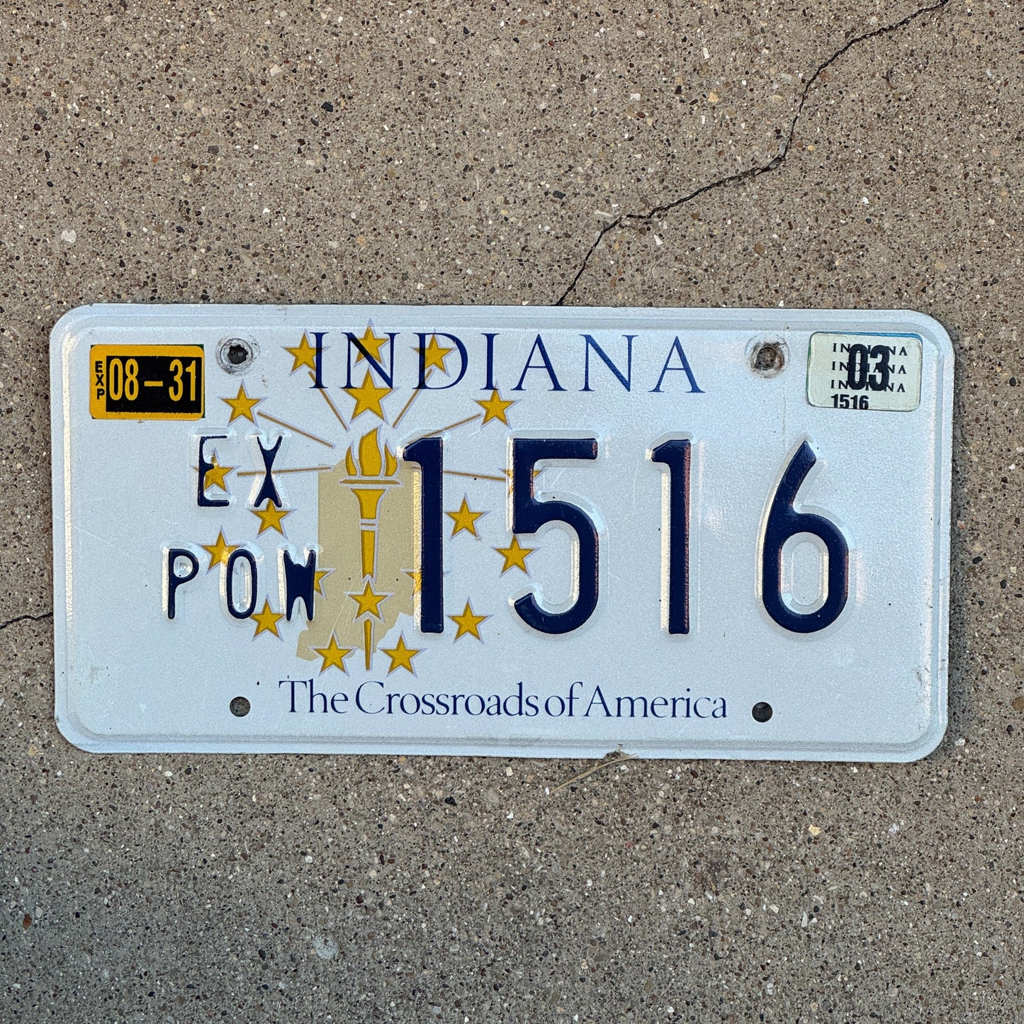 Photo of a 1999 2003 Indiana Ex Prisoner of War License Plate Auto Tag Garage Decor Vintage POW 1516 with original patina
