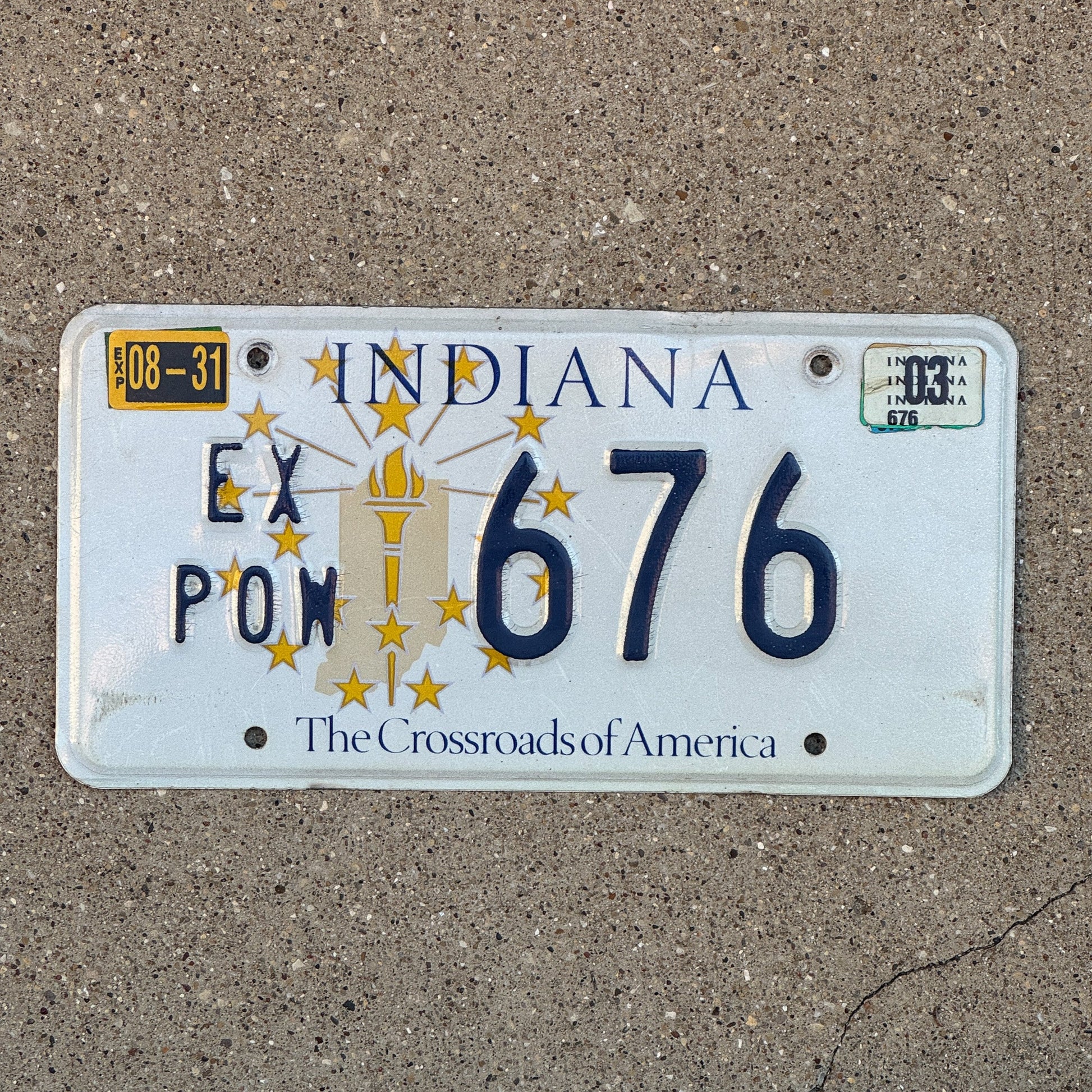 Photo of a 1999 2003 Indiana Ex Prisoner of War License Plate Auto Tag Garage Decor Vintage POW 676 with original patina