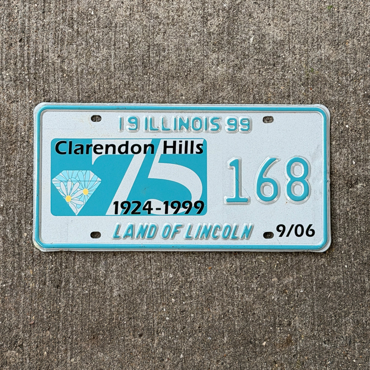 Photo of a 1999 Illinois Event License Plate Auto Tag Garage Decor Vintage Claredon Hills Diamond Jubilee 168 with original patina