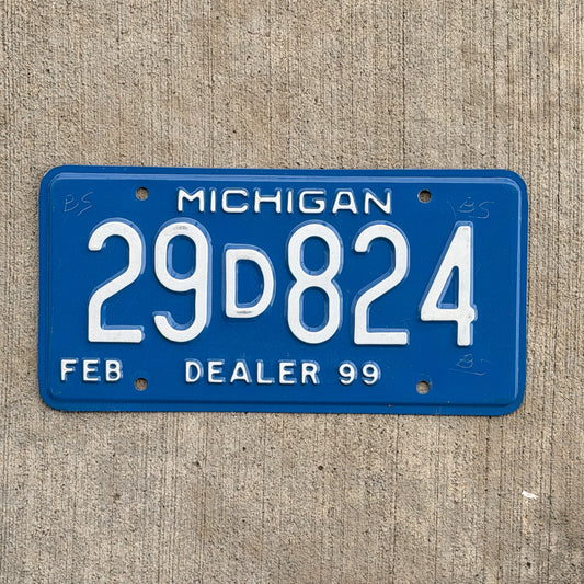 Photo of a 1999 Michigan Dealer License Plate Auto Tag Garage Decor Vintage 29 D 824 with original patina