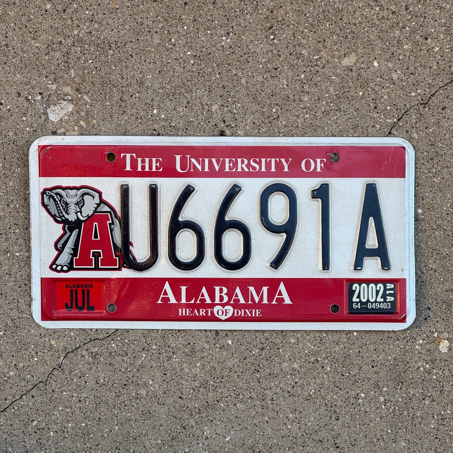 Photo of a 2000 2002 Alabama Graphic / Specialty License Plate Auto Tag Garage Decor Vintage University of Alabama U 6691 A with original patina