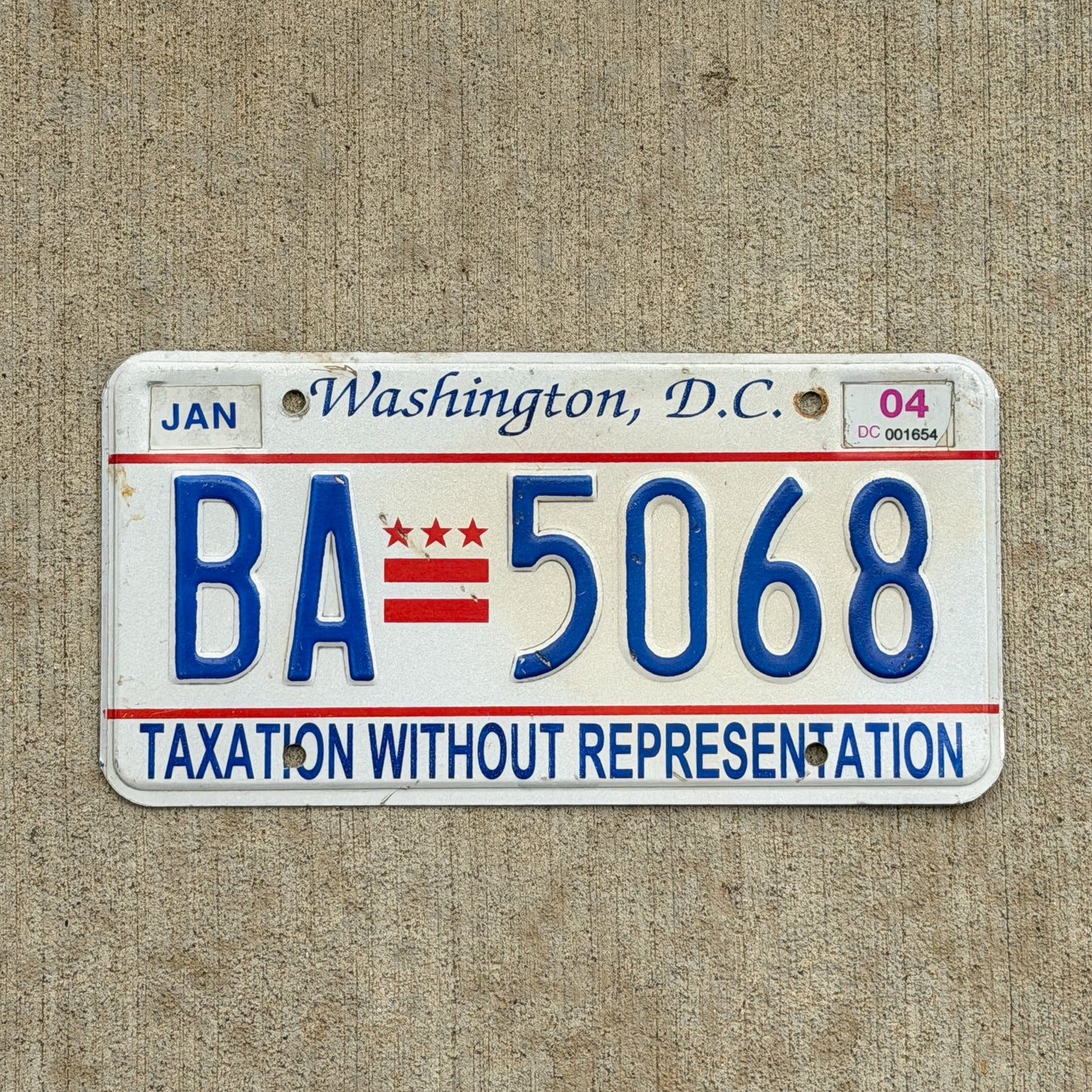 Photo of a 2000 2004 Washington DC License Plate Auto Tag Garage Decor Vintage Taxation Without Representation BA 5068 with original patina