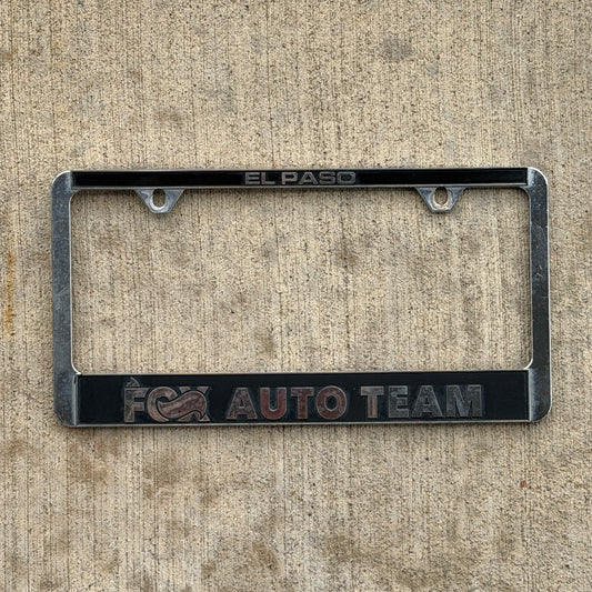 Photo of a 2000 Era El Paso Texas License Plate Frame Auto Tag Garage Decor Vintage
 Fox Auto Team Plastic with original patina