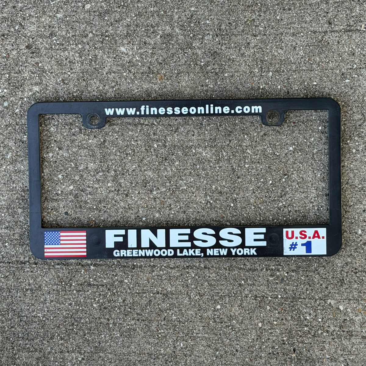 Photo of a 2000 Era Finesse Online Greenwood Lake USA #1 New York License Plate Frame Auto Tag Garage Decor Vintage
 Plastic with original patina