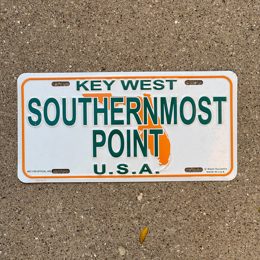 Photo of a 2000 Era Florida Graphic / Specialty Booster License Plate Auto Tag Garage Decor Vintage Southernmost Point U.S.A. Key West with original patina