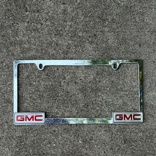 Photo of a 2000 Era GMC Metal Chrome License Plate Frame Auto Tag Garage Decor Vintage
 with original patina