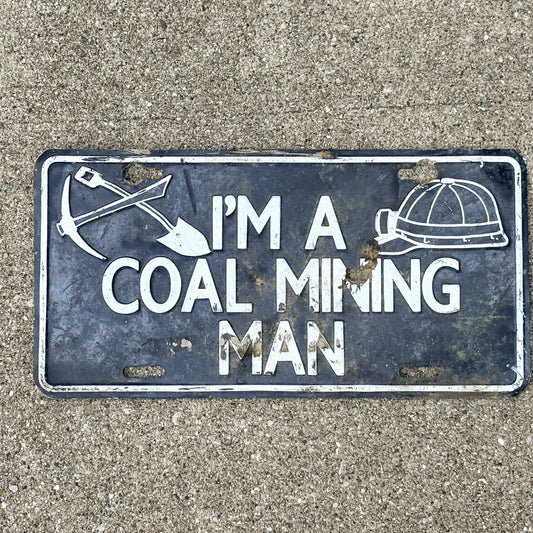 Photo of a 2000 Era I'm a Coal Mining Man Booster License Plate Auto Tag Garage Decor Vintage
 Metal with original patina