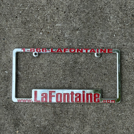 Photo of a 2000 Era LAFONTAINE Michigan License Plate Frame Auto Tag Garage Decor Vintage
 Dealership Plastic with original patina