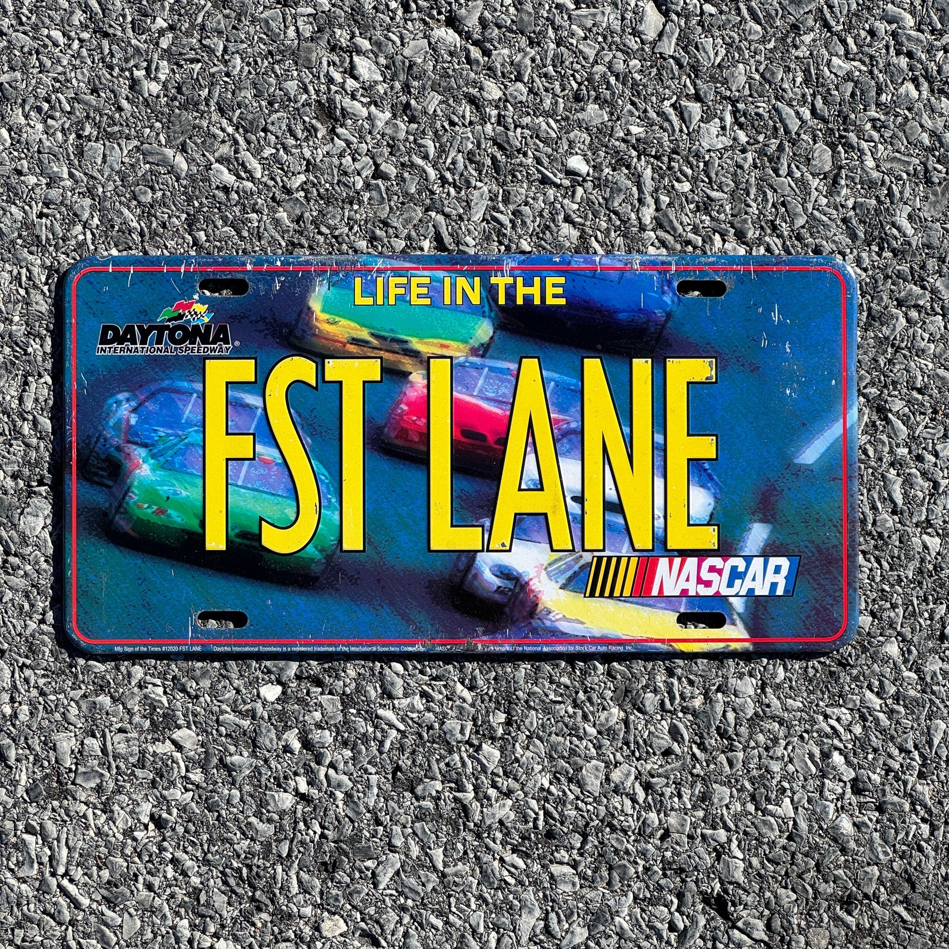 Photo of a 2000 Era License Plate Auto Tag Garage Decor Vintage Nascar FST LANE