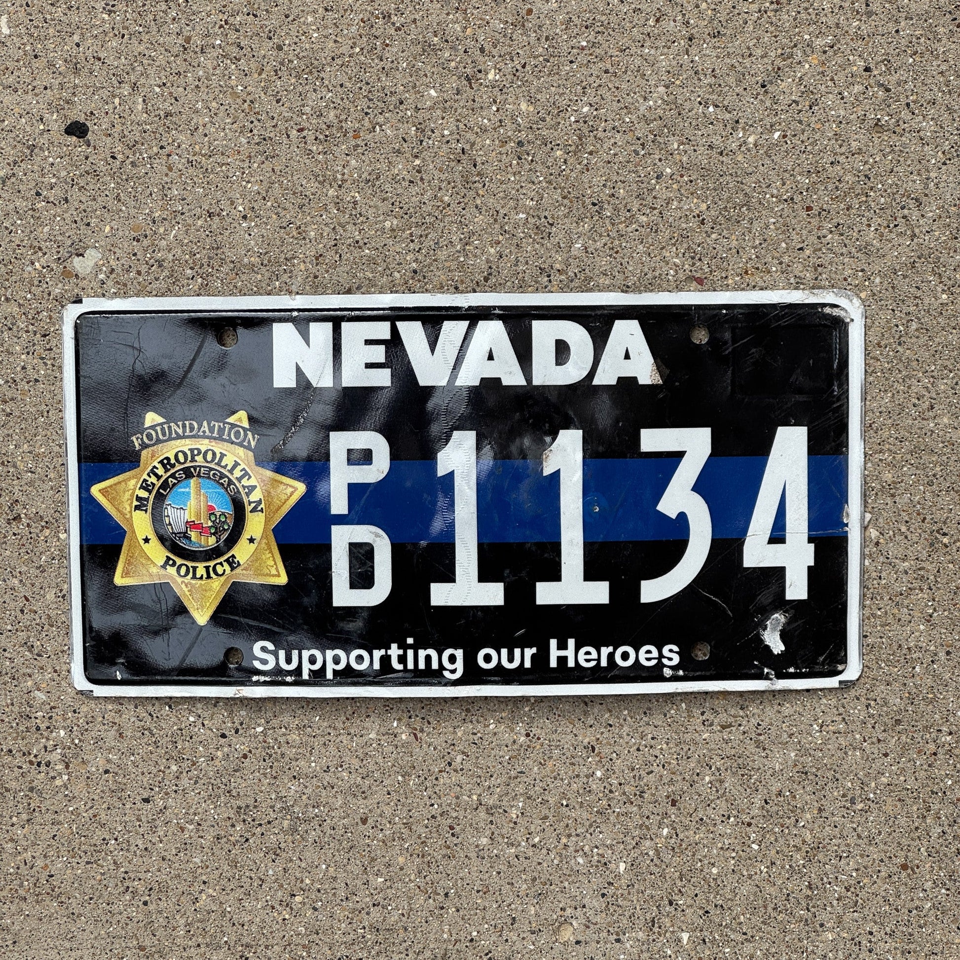 Photo of a 2000 Era Nevada Graphic / Specialty License Plate Auto Tag Garage Decor Vintage Friends of Las Vegas Police PD 1134