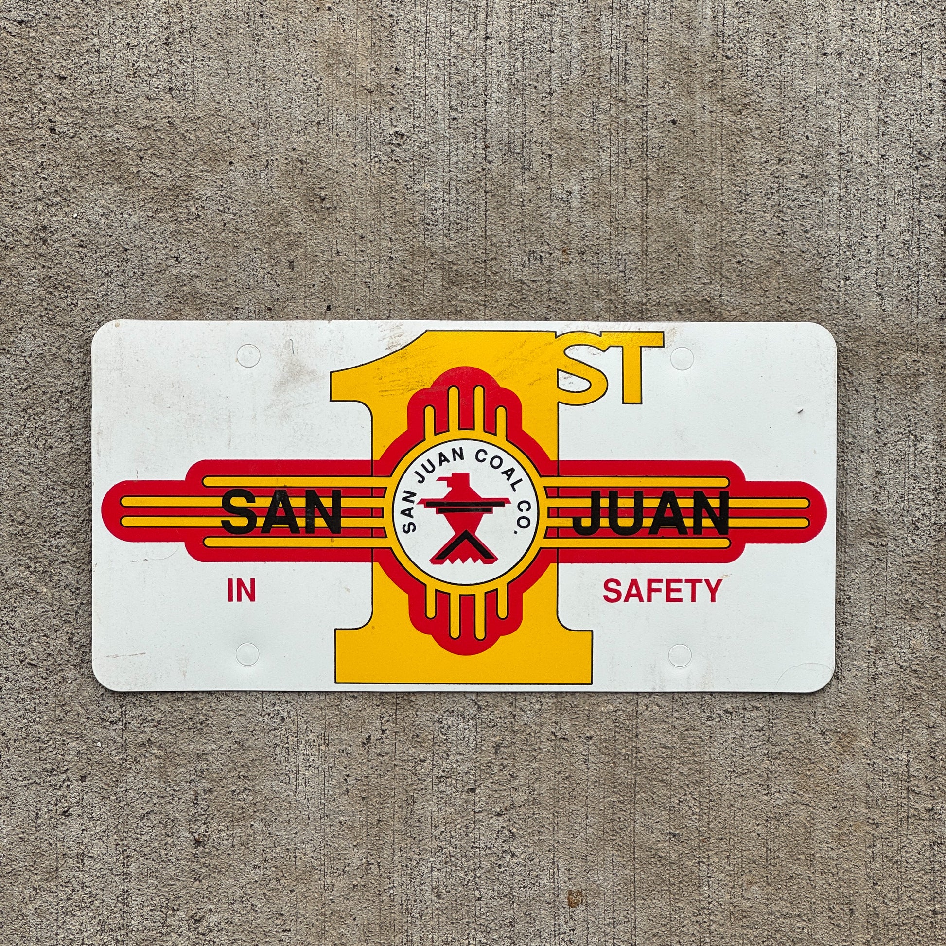 Photo of a 2000 Era San Juan New Mexico Booster License Plate Auto Tag Garage Decor Vintage San Juan Coal Co 1st in Safety Flimsy Plastic with original patina