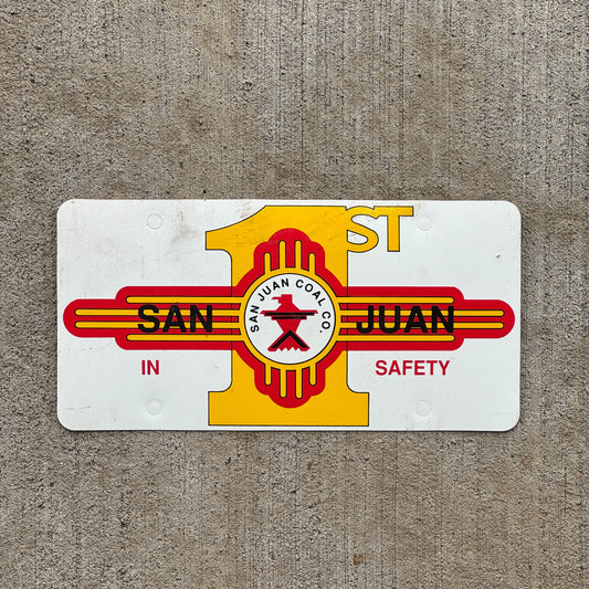 Photo of a 2000 Era San Juan New Mexico Booster License Plate Auto Tag Garage Decor Vintage San Juan Coal Co 1st in Safety Flimsy Plastic with original patina