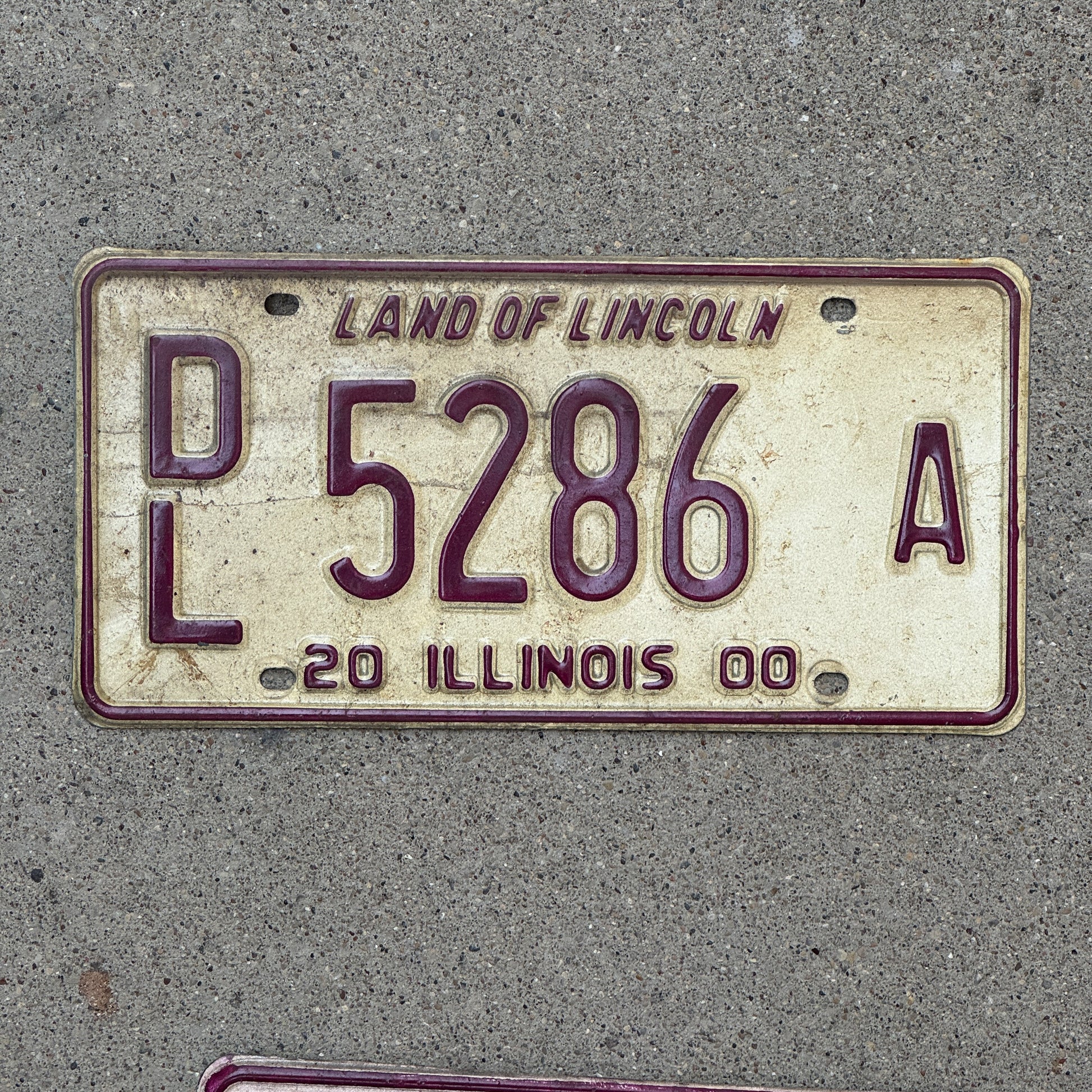 Photo of a 2000 Illinois Dealer License Plate Auto Tag 2 Vintage Garage 5286 A with original patina