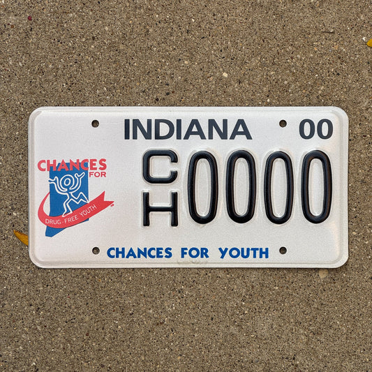 Photo of a 2000 Indiana Graphic Sample License Plate Auto Tag Garage Decor Vintage Chances For Youth CH 0000 with original patina