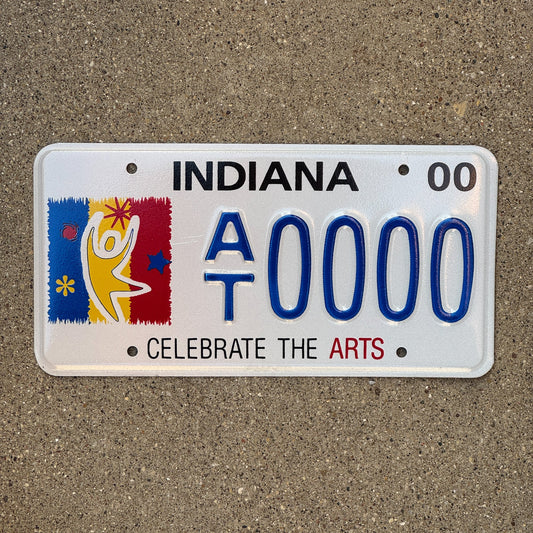 Photo of a 2000 Indiana Graphic Sample License Plate Auto Tag Garage Decor Vintage Clebrate Arts Trust AT 0000 with original patina