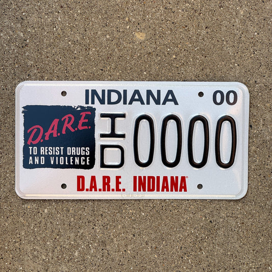 Photo of a 2000 Indiana Graphic Sample License Plate Auto Tag Garage Decor Vintage DARE ID 0000 with original patina