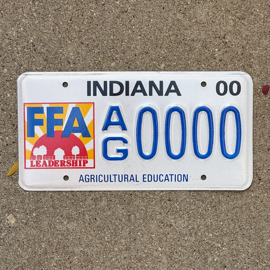Photo of a 2000 Indiana Graphic Sample License Plate Auto Tag Garage Decor Vintage Future Farmers of America AG 0000 with original patina