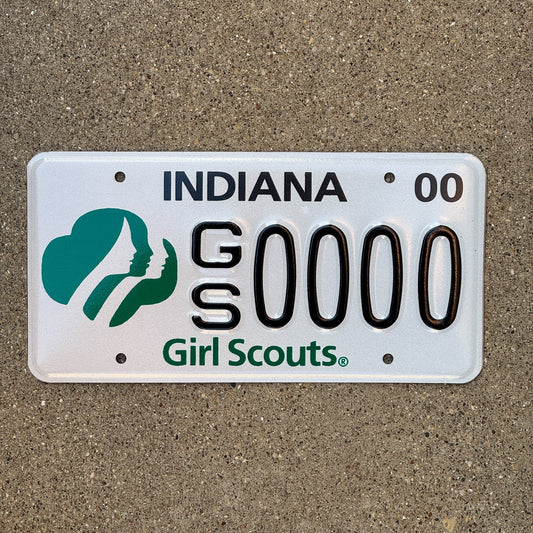 Photo of a 2000 Indiana Graphic Sample License Plate Auto Tag Garage Decor Vintage Girl Scouts of America GS 0000 with original patina