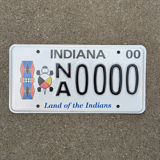Photo of a 2000 Indiana Graphic Sample License Plate Auto Tag Garage Decor Vintage Land of The Indians Tribal NA 0000 with original patina