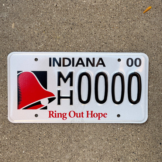 Photo of a 2000 Indiana Graphic Sample License Plate Auto Tag Garage Decor Vintage Ring Out Hope MH 0000 with original patina