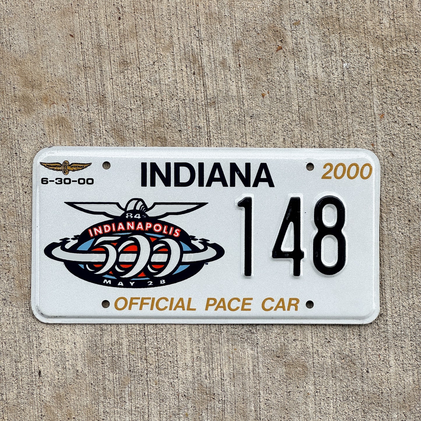 Photo of a 2000 Indiana Pace Car License Plate Auto Tag Garage Decor Vintage Indy 500 Racing Enthusiast Collectible 148 with original patina