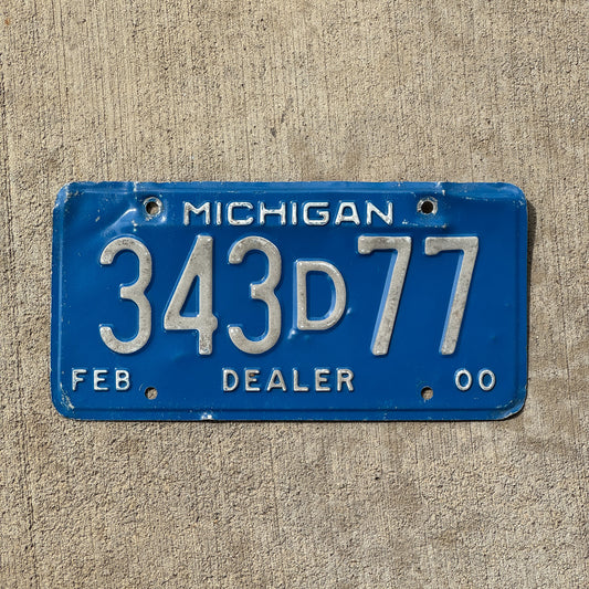 Photo of a 2000 Michigan Dealer License Plate Auto Tag Garage Decor Vintage 343 D 77 with original patina