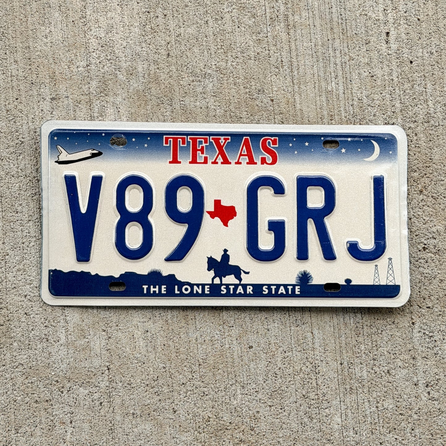 Photo of a 2000 Texas License Plate Auto Tag 1 Vintage Garage V89 GRJ with original patina